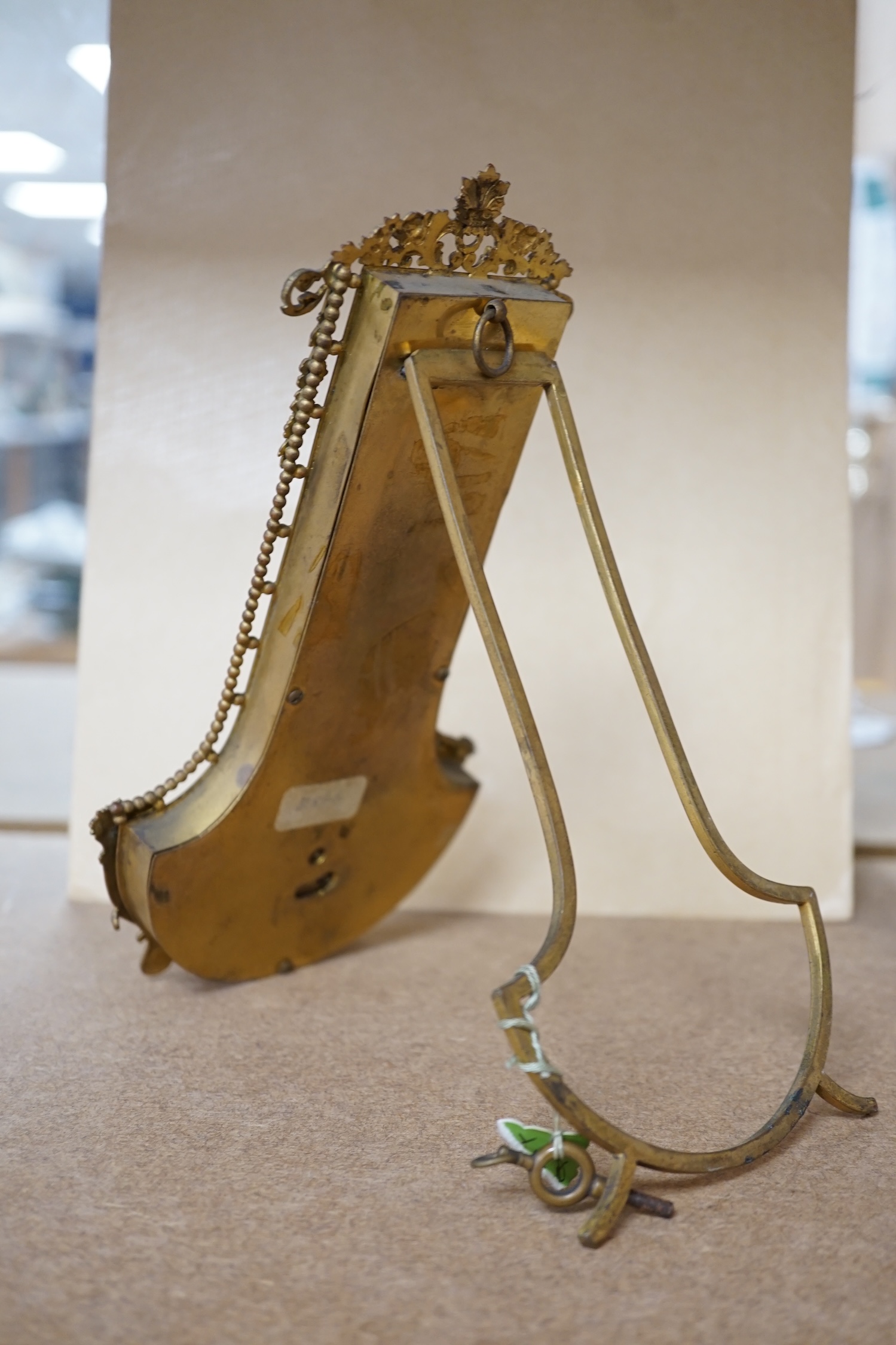 An onyx and gilt metal easel timepiece and thermometer, 20cm high. Condition - fair